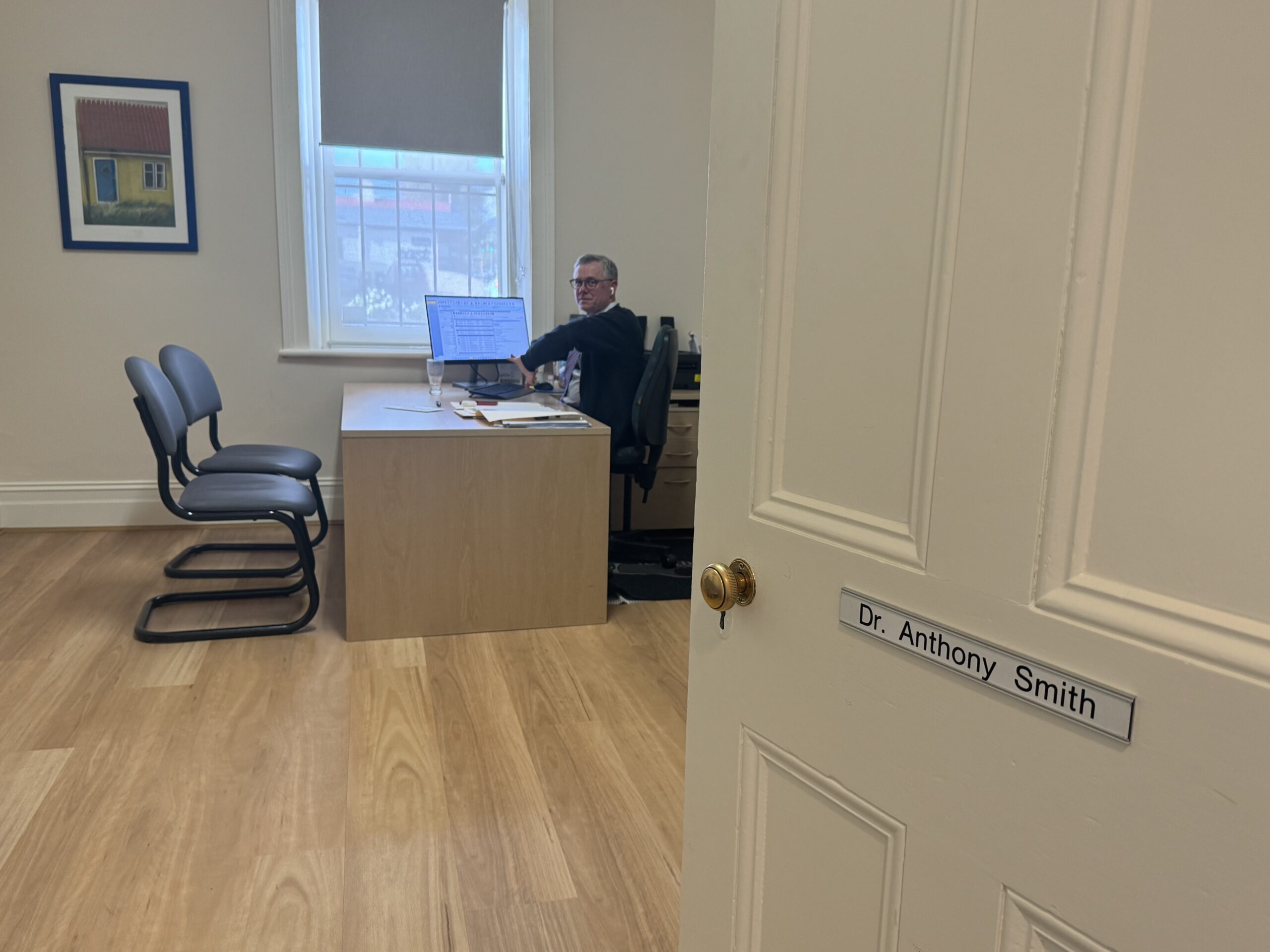 Dr Anthony Smith sitting in his consulting room at AllergySA in Beulah Park